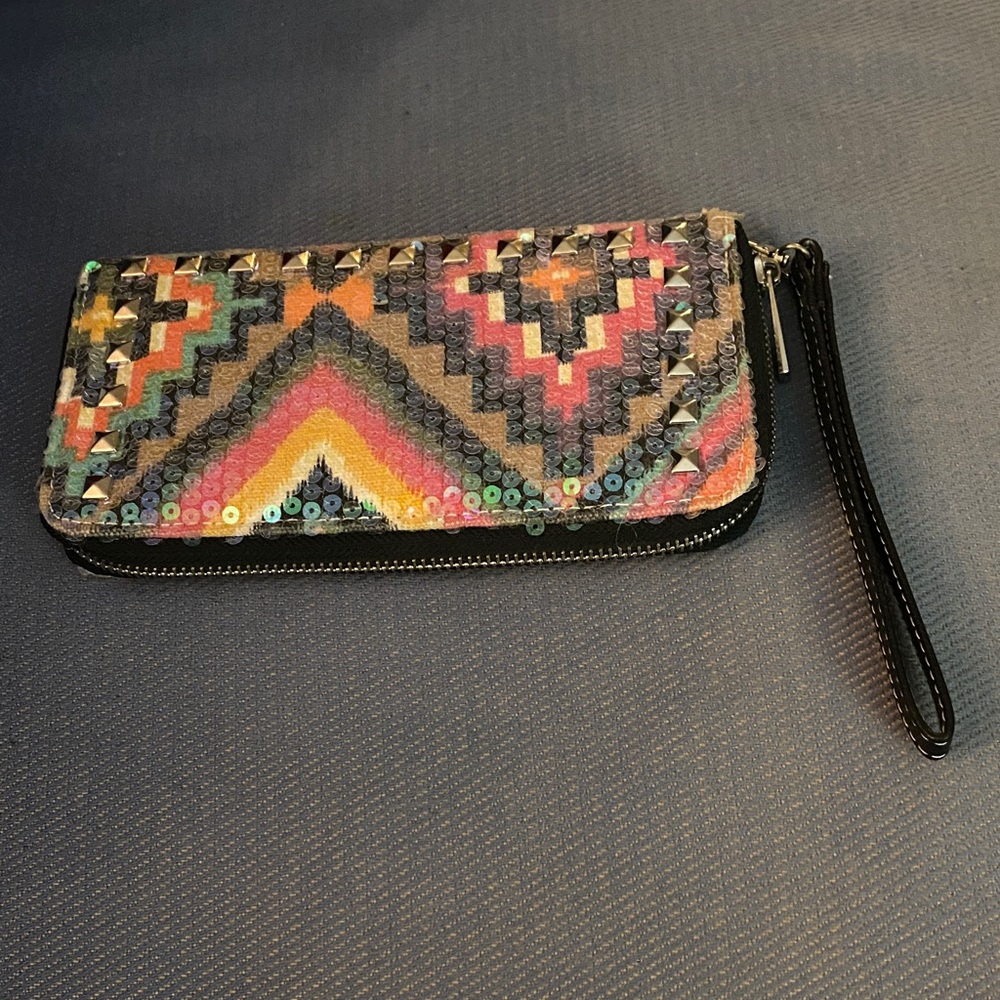 Wristlet zip up sequined purse.